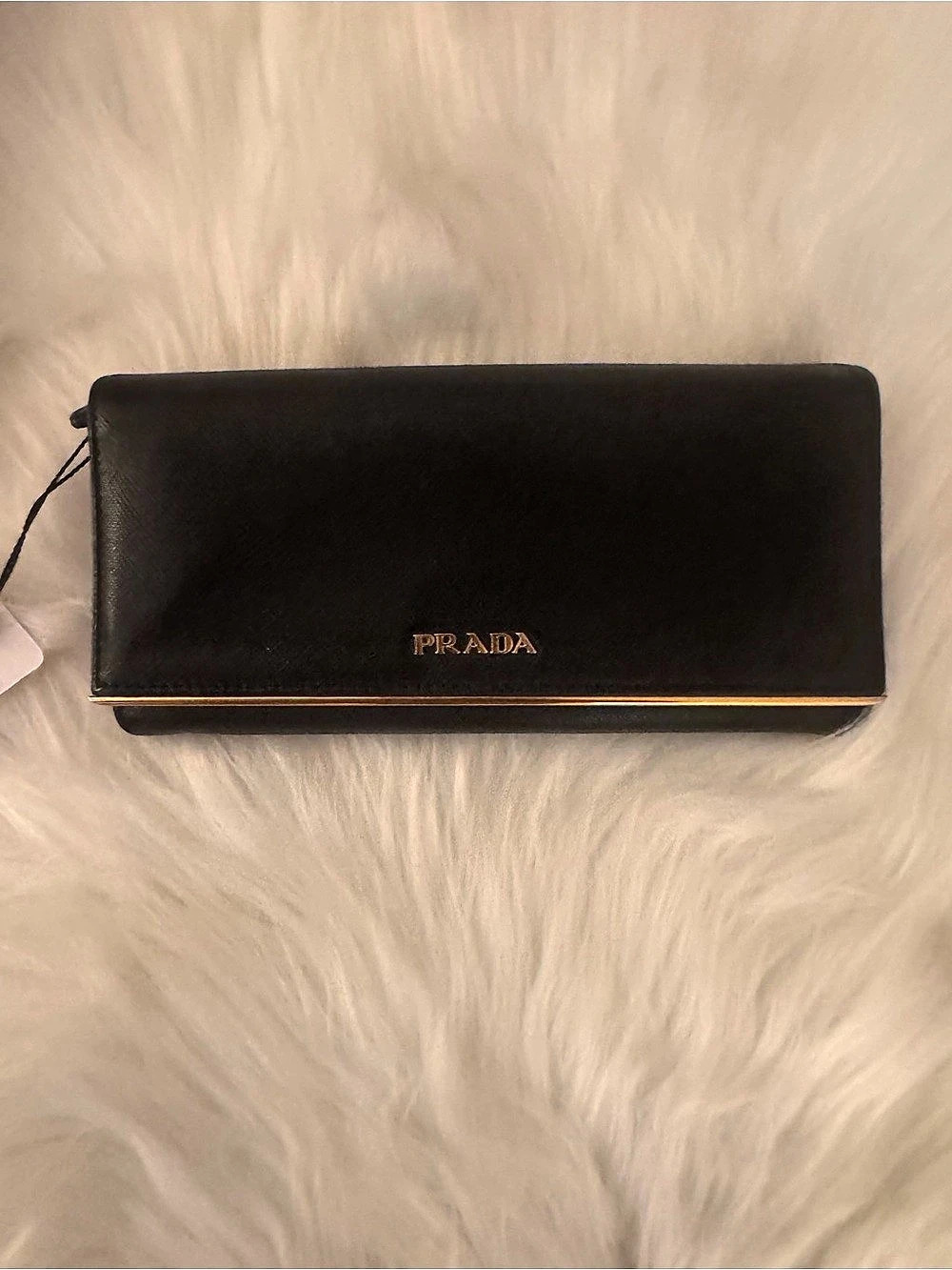 Prada Black Saffiano Leather Flap Wallet with Gold Hardware Trim bar